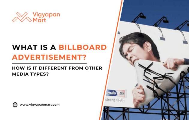 A large billboard features a man appearing to bite and tear through the billboard material. The text on the left reads, “What is a Billboard Advertisement? How is it different from other media types?” with Vigyapan Mart branding.