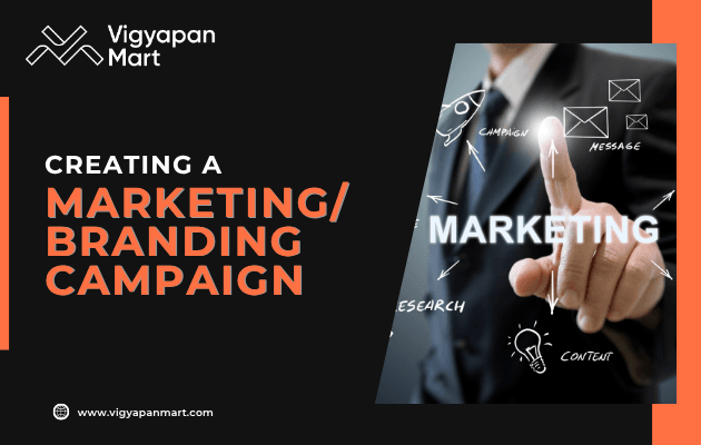 A person in a suit points to the word "MARKETING" on a virtual screen with related terms, alongside text promoting a marketing/branding campaign by Vigyapan Mart.