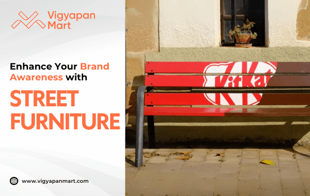 A red bench with white painted branding sits on a tiled walkway against a yellow wall, promoting Vigyapan Mart’s street furniture advertising services. Text highlights enhancing brand awareness.
