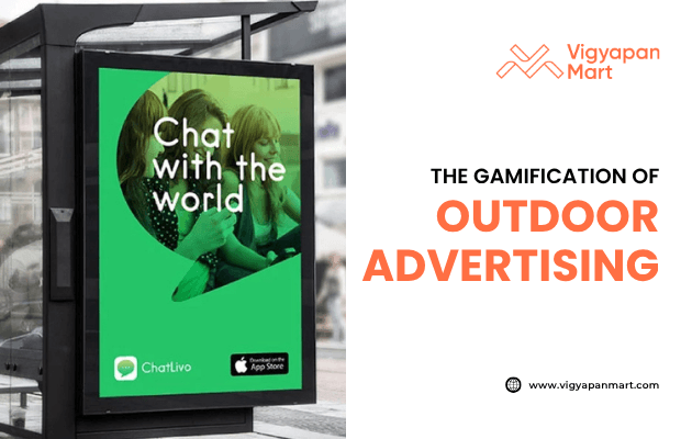Outdoor billboard ad at bus stop promoting ChatLivo app with slogan "Chat with the world," featuring smartphone users, App Store icon, and text “Gamification of Outdoor Advertising” by Vigyapan Mart.