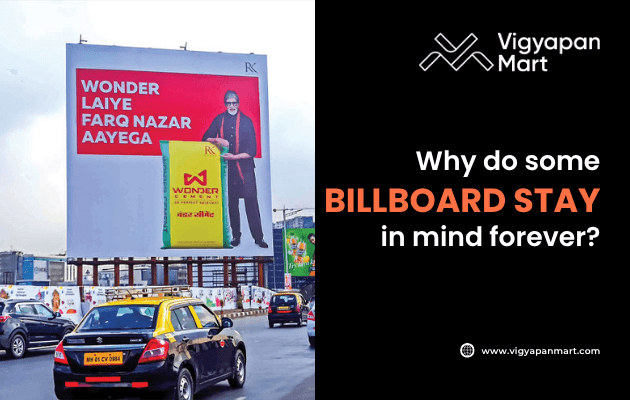 Large roadside billboard in a busy city showing Wonder Cement ad with text “Wonder Laiye Farq Nazar Aayega” and celebrity endorsement, alongside Vigyapan Mart graphic that asks “Why do some billboard stay in mind forever?” with logo and website link.