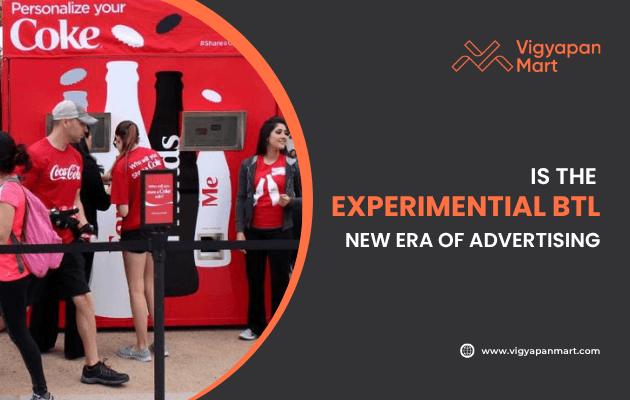 Outdoor brand activation event with Coca-Cola’s “Personalize Your Coke” vending machine, where people interact with the customized product experience. Overlay text reads “Is the Experiential BTL New Era of Advertising” with Vigyapan Mart branding, highlighting experiential below-the-line marketing strategies.