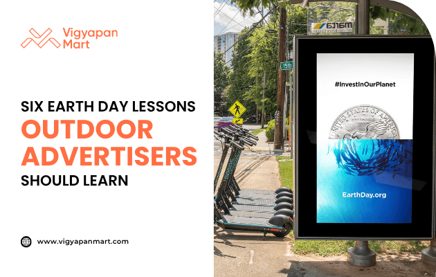 Digital outdoor ad display on a sidewalk promoting Earth Day with the text “#InvestInOurPlanet” and website EarthDay.org, featuring an image of a coin and ocean waves. On the left, Vigyapan Mart branding with headline “Six Earth Day Lessons Outdoor Advertisers Should Learn” and website www.vigyapanmart.com