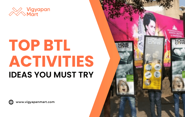 Street marketing campaign with two people wearing display boards showcasing product advertisements as part of BTL (Below The Line) activities. On the left, Vigyapan Mart branding with text “Top BTL Activities Ideas You Must Try” and website www.vigyapanmart.com