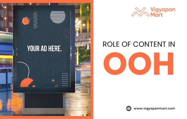 Digital outdoor advertising display with placeholder text “Your Ad Here” and abstract design elements, placed on a city street at night. On the right, Vigyapan Mart branding with the text “Role of Content in OOH” and website www.vigyapanmart.com