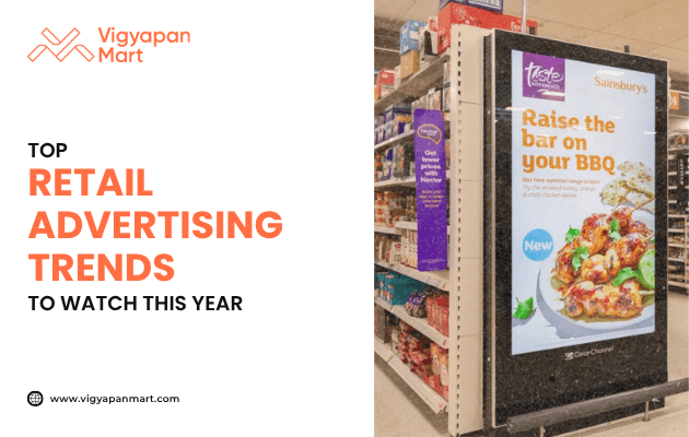 Digital retail advertising display inside a supermarket showcasing Sainsbury’s BBQ food promotion, highlighted by Vigyapan Mart with text “Top Retail Advertising Trends to Watch This Year,” emphasizing modern in-store marketing strategies.