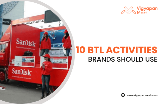 Vigyapan Mart graphic highlighting “10 BTL Activities Brands Should Use,” featuring a SanDisk promotional van with staff in red uniforms engaging in street marketing.