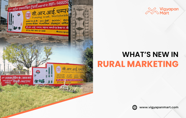 Vigyapan Mart graphic discussing what’s new in rural marketing, featuring wall paintings and hoardings in a village area promoting C.R.I. Pumps with bold text and product visuals.