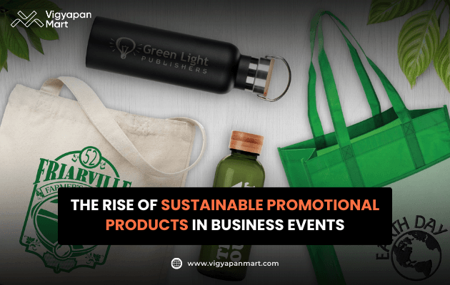 Vigyapan Mart graphic showing eco-friendly promotional products like reusable tote bags, water bottles, and a thermos. Text overlay reads “The Rise of Sustainable Promotional Products in Business Events.” Vigyapan Mart logo and website are displayed.