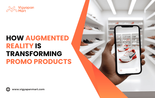 Person holding smartphone displaying augmented reality view of red and white sneakers in a shoe store, showcasing digital product visualization. Marketing banner text reads 'How Augmented Reality is Transforming Promo Products' by Vigyapan Mart, highlighting AR technology in promotional merchandise.