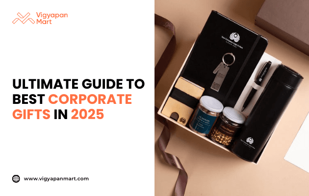 Luxury corporate gift box for 2025 featuring branded notebook with pen drive, black thermal flask, premium pen, and jars of dry fruits on beige background. Marketing banner text reads 'Ultimate Guide to Best Corporate Gifts in 2025' by Vigyapan Mart, highlighting elegant business gifting ideas.