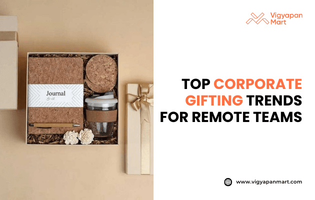 Eco-friendly corporate gifting box for remote teams featuring cork-covered journal, reusable coffee cup, coasters, and decorative items on beige background. Marketing banner text reads 'Top Corporate Gifting Trends for Remote Teams' by Vigyapan Mart, highlighting sustainable and practical gift ideas.