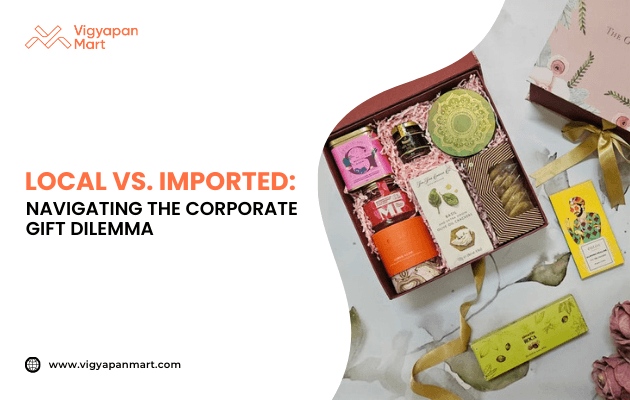 Open corporate gift box containing assorted local and imported items such as tea, snacks, skincare products, and packaged treats, placed on a decorated surface. Marketing banner text reads 'Local vs. Imported: Navigating the Corporate Gift Dilemma' by Vigyapan Mart, emphasizing choices in business gifting.