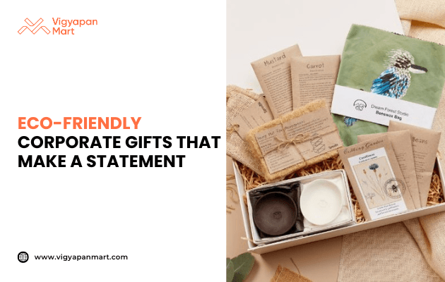 Eco-friendly corporate gift box featuring plant seed packets, biodegradable pots, jute pouch, and sustainable packaging materials. Marketing banner text reads 'Eco-Friendly Corporate Gifts That Make a Statement' by Vigyapan Mart, promoting green and sustainable business gifting solutions.