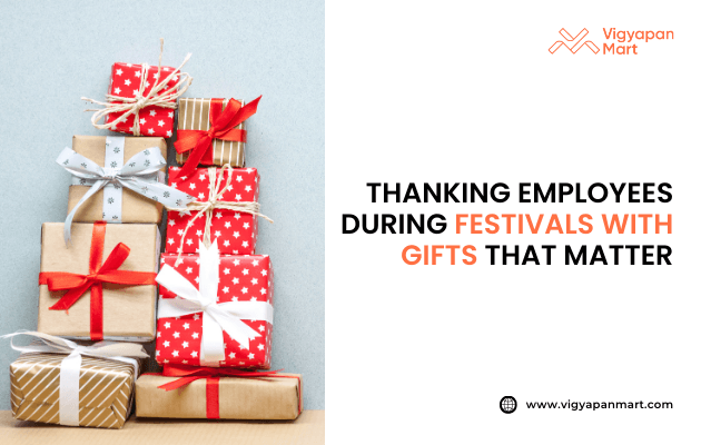 Pile of wrapped gift boxes with red, gold, and white ribbons beside text “Thanking Employees During Festivals with Gifts That Matter,” featuring Vigyapan Mart logo and website.