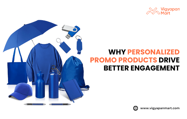Collection of personalized promotional products in blue including umbrella, t-shirt, tote bag, water bottles, cap, pens, keychains, USB drive, and drawstring bag. Text reads: “Why personalized promo products drive better engagement” with Vigyapan Mart logo. Branded merchandise for marketing and customer engagement.
