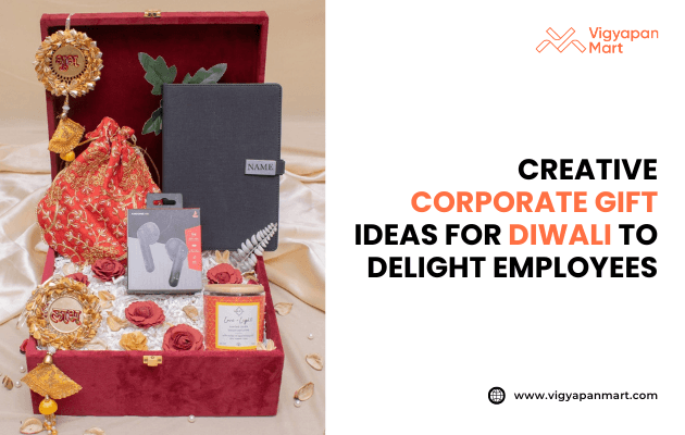 Elegant Diwali corporate gift hamper in a red velvet box containing a notebook, wireless earbuds, candle, decorative pouch, artificial flowers, and festive ornaments, with text “Creative Corporate Gift Ideas for Diwali to Delight Employees” alongside Vigyapan Mart logo and website.