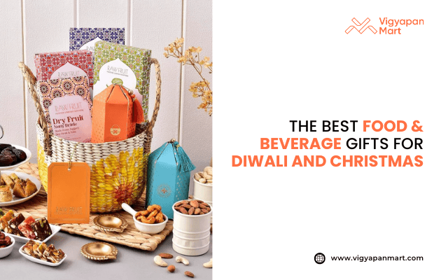 Festive gift hamper featuring assorted dry fruits, snacks, and premium packaged treats in a decorative basket with colorful boxes and tins. Display includes nuts, sweets, and festive décor, promoting “The Best Food & Beverage Gifts for Diwali and Christmas” by Vigyapan Mart. Ideal for festive gifting, holiday hampers, and Diwali or Christmas gift ideas. Website: www.vigyapanmart.com