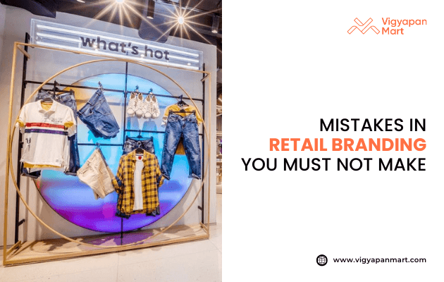Bright retail display featuring shirts, jeans, and bags, with "what's hot" sign above. Text reads "Mistakes in Retail Branding You Must Not Make." Modern, engaging tone.