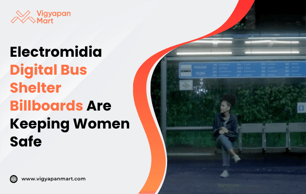 A woman sits on a bus shelter bench illuminated by digital billboards highlighting safety measures for women at night.