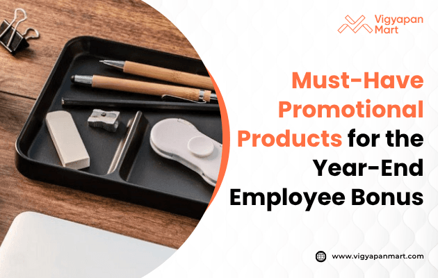 A desk features a tray with pens, erasers, and a clip, next to text: "Must-Have Promotional Products for Year-End Employee Bonus" beside a company logo.