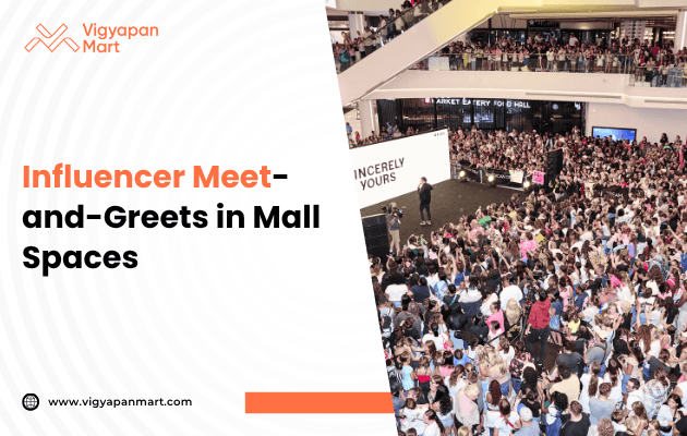 A large crowd gathers in a mall for an influencer meet-and-greet event. People are seated around a stage with a speaker, under bright lighting. The atmosphere is energetic.