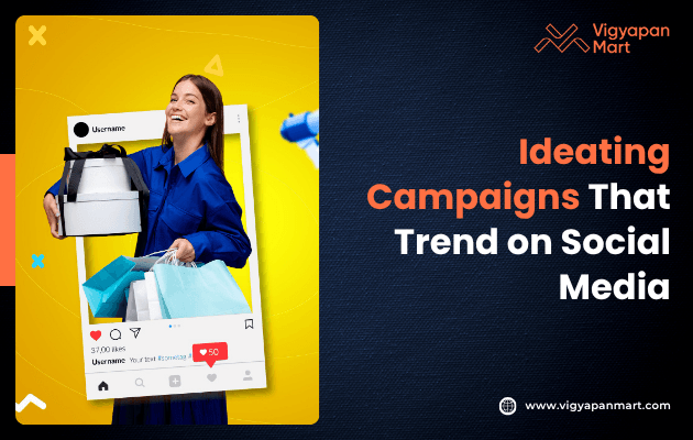 A smiling person in a blue outfit holds shopping bags and boxes against a bright yellow background. A social media frame overlays the image. Text reads, “Ideating Campaigns That Trend on Social Media.” The logo “Vigyapan Mart” appears in the corner.