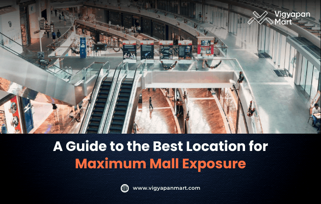 Spacious, well-lit mall interior featuring escalators and retail storefronts, with the text overlay “A Guide to the Best Location for Maximum Mall Exposure” and the Vigyapan Mart logo.