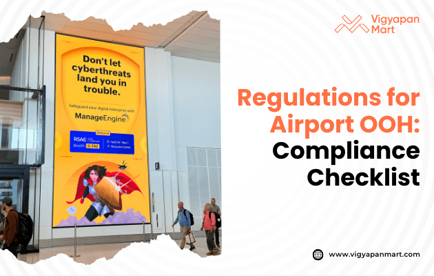 An airport digital billboard displays a ManageEngine advertisement about cyberthreat protection, featuring a cartoon superhero and security icons in a vibrant, informative style.