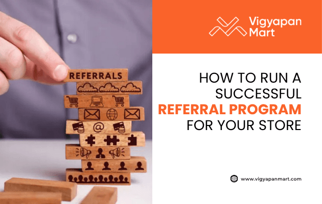 Hand stacking wooden blocks with icons for referrals, email, shopping cart, and networking, highlighted by Vigyapan Mart with text “How to Run a Successful Referral Program for Your Store.