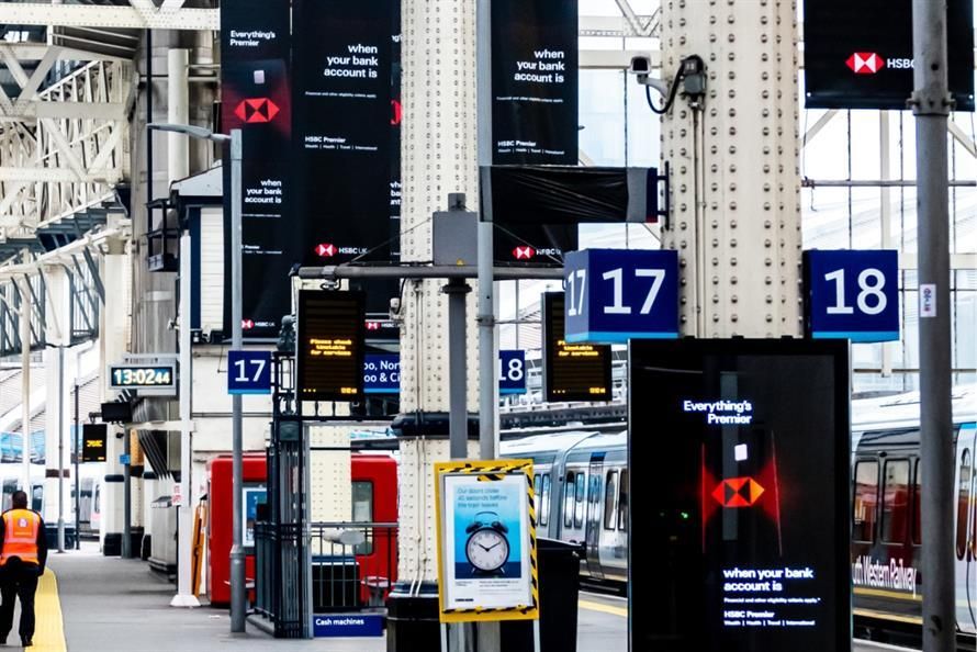 High-speed rail advertising campaign inside a modern train station